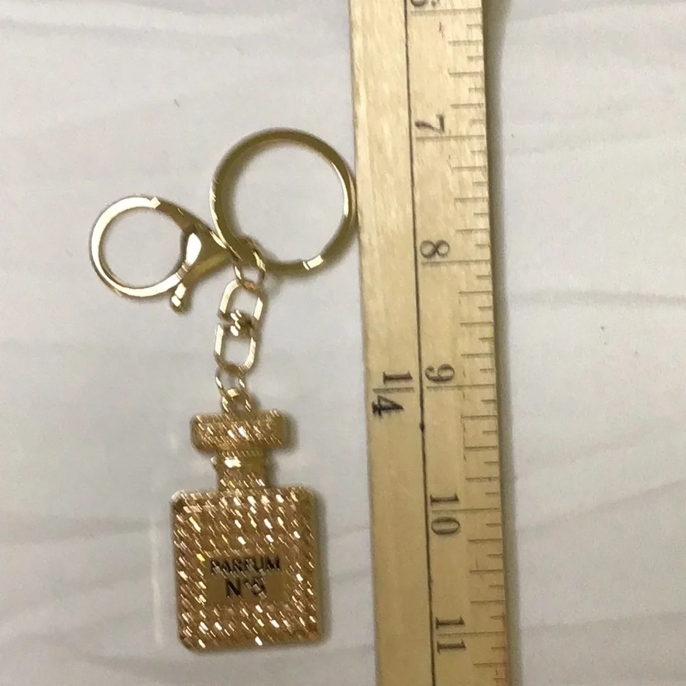 Gold finish Key Holder with‎ Perfume Bottle Design